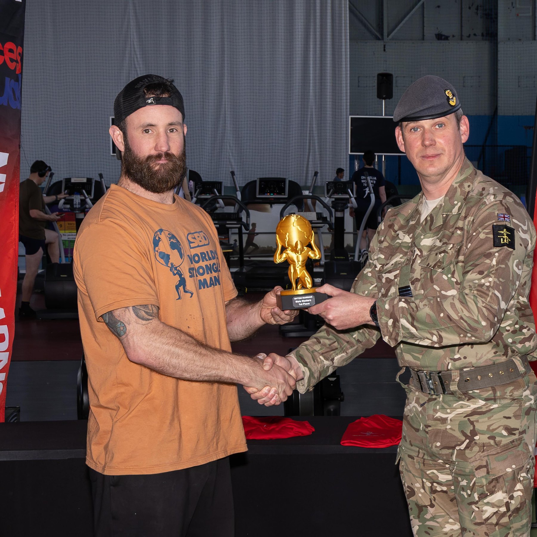 Matt Tatman receiving his Forces Strongman trophy
