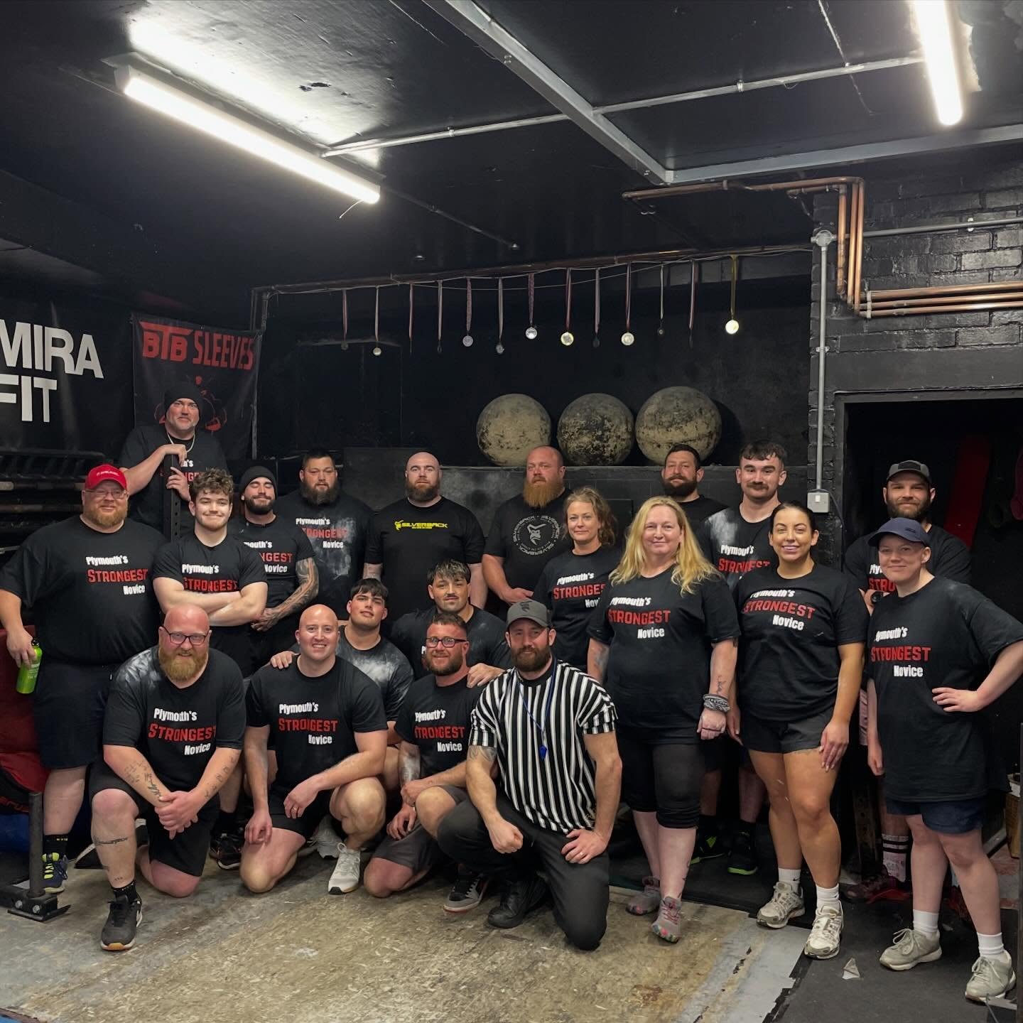 Competitors at Plymouth Strongest Novice 2026 inside the gym, with racks and Atlas stones